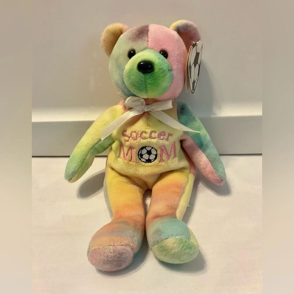4 stuffed animals: blue dogs, hot pink elephant dog & soccer mom multicolor bear
